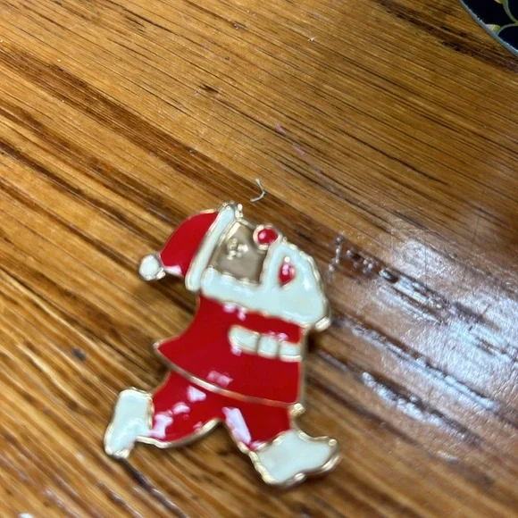 Assorted costume jewelry.  Includes 8 pieces. Seven pins and 1 bracelet. - Picture 9 of 10